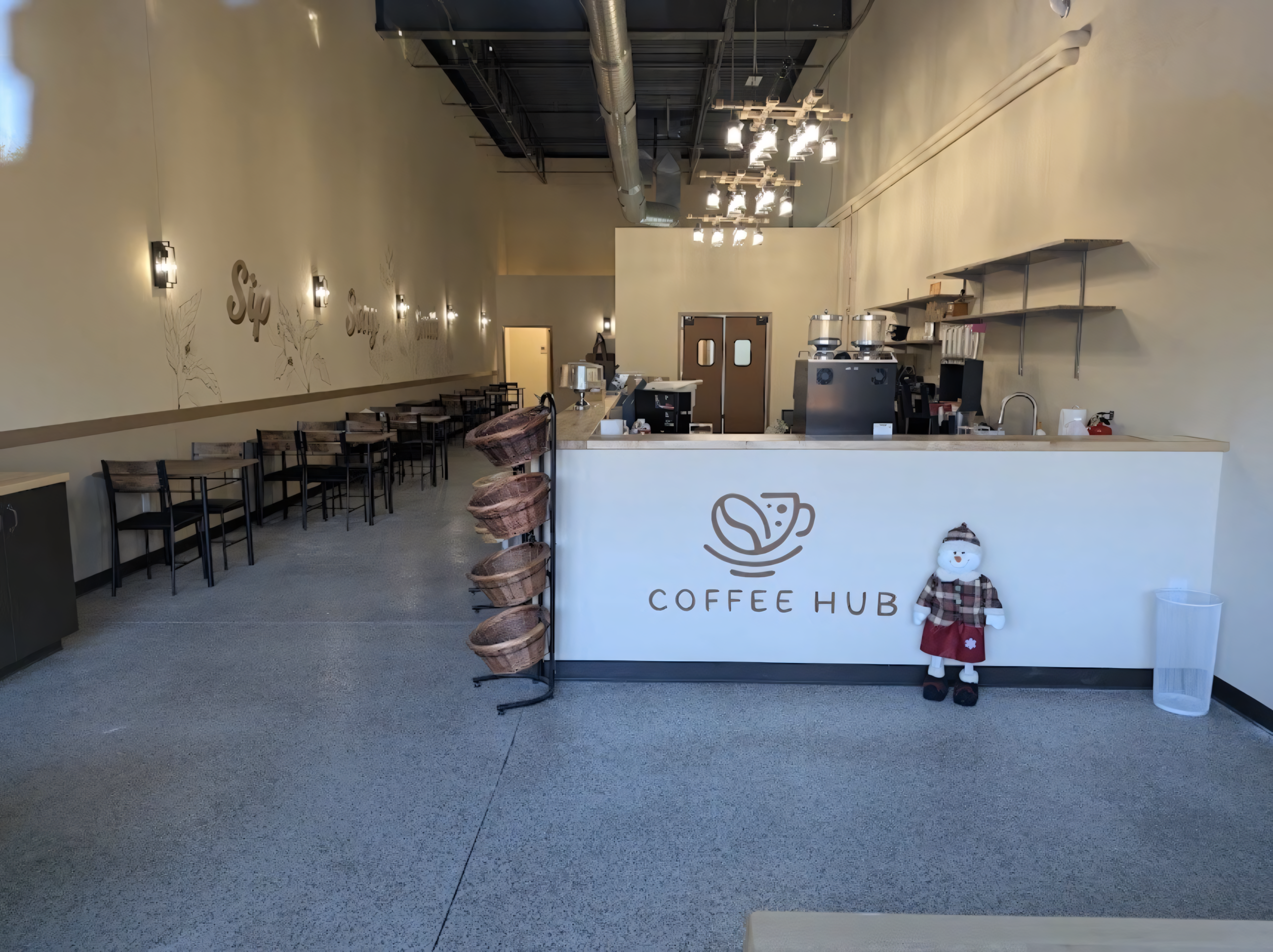 The Coffee Hub interior with seating and the branded front counter